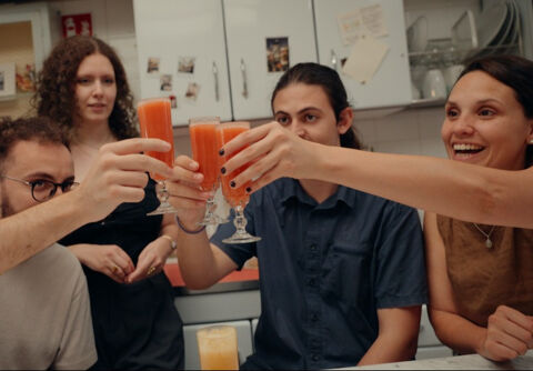 group of friends cheers with cocktails in florence bar